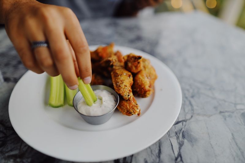 Platter of crispy wings at a catering event