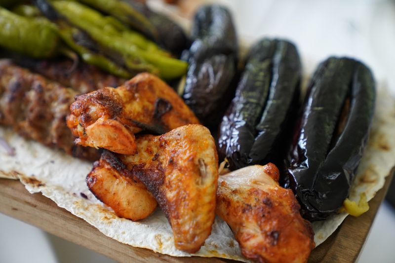 Assorted wing sauces and dips on a catering table